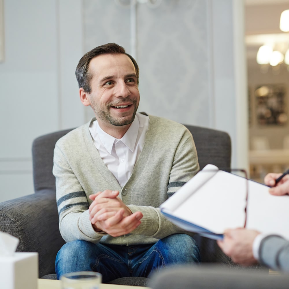 Smiling man in counselling session