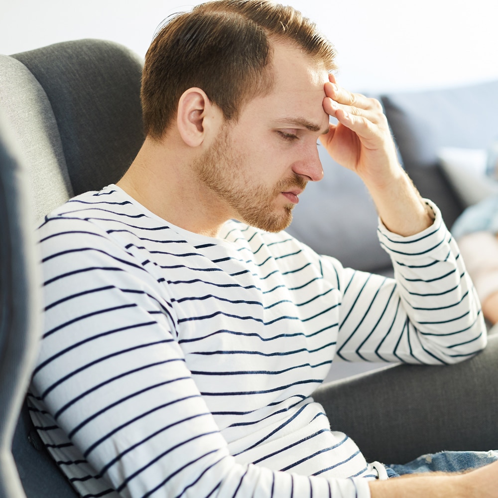 Man with anxiety Man with anxiety sitting down