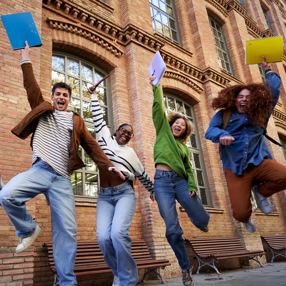 Students jumping after exam in Sydney Uni students jumping after exam in Sydney