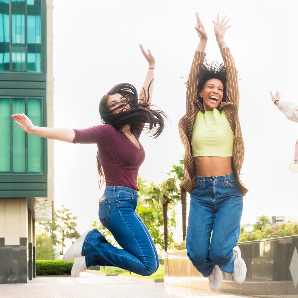 Happy girls jumping after hypnotherapy Happy girls jumping after hypnotherapy success