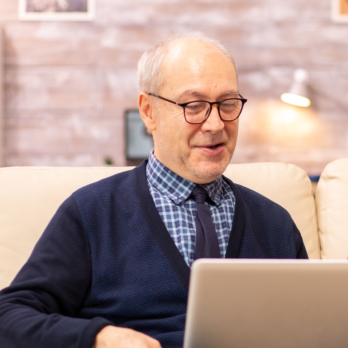 Old man having hypnotherapy online