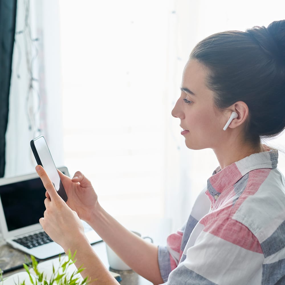 Woman using mobile for hypnotherapy session Woman using mobile for hypnotherapy session
