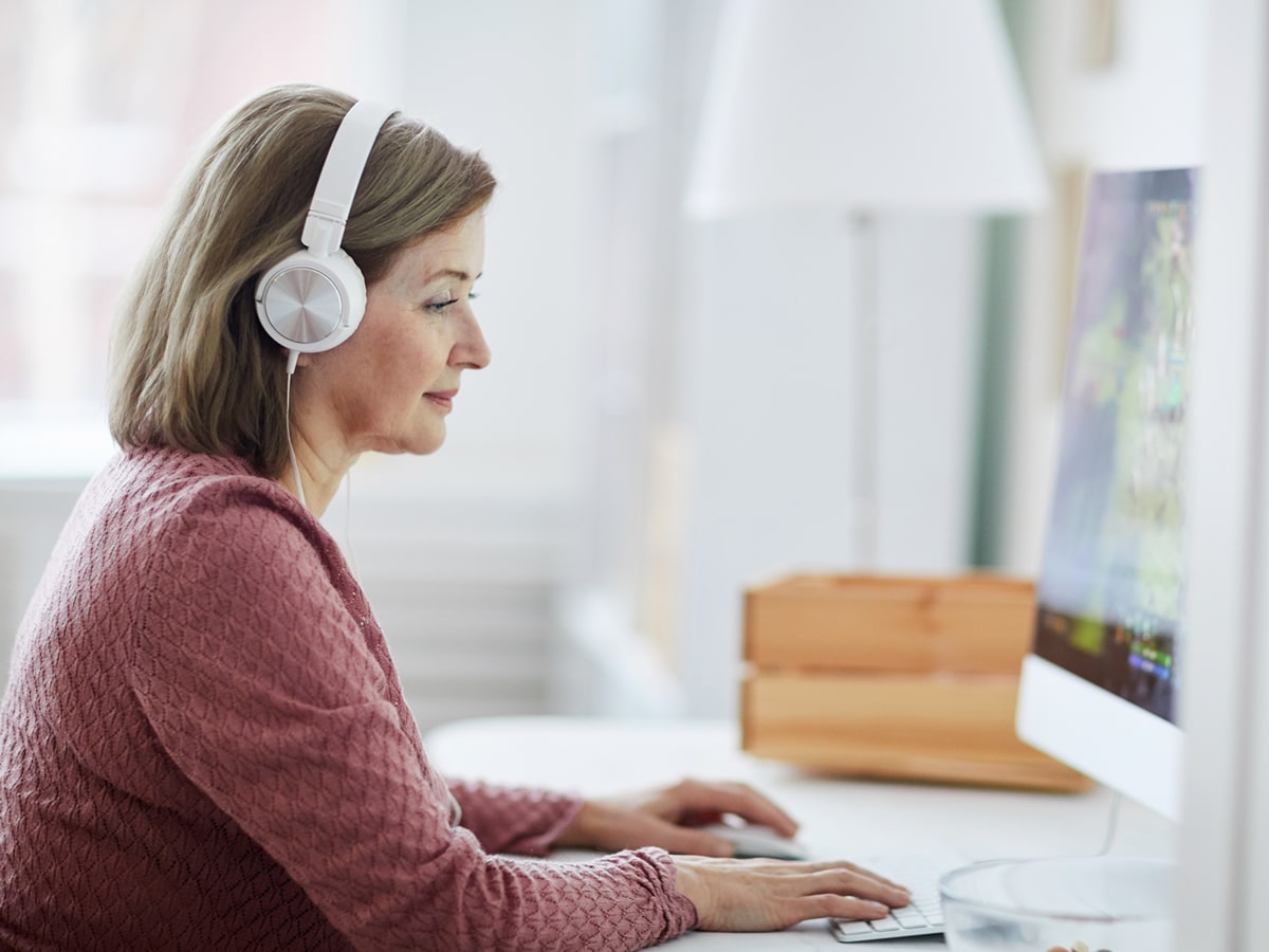 Woman using On Demand Hypnosis on computer