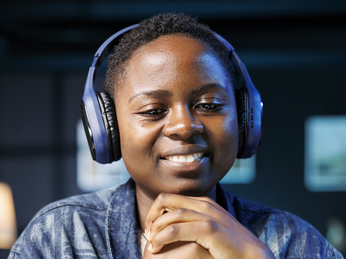 Woman with headphones smiling