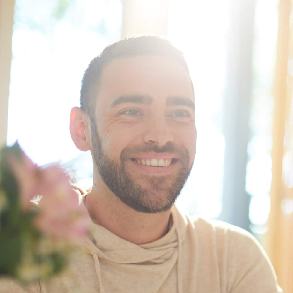 Man smiling after hypnotherapy session in Sydney Man smiling after hypnotherapy session in Sydney