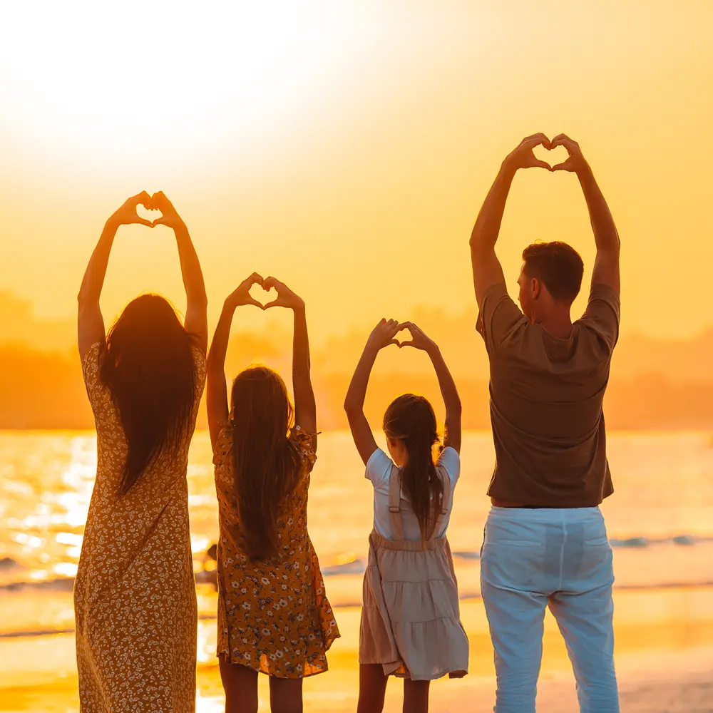 Family after hypnotherapy for mosman happy at beach Family after hypnotherapy for Mosman having happy mement at sunset beach
