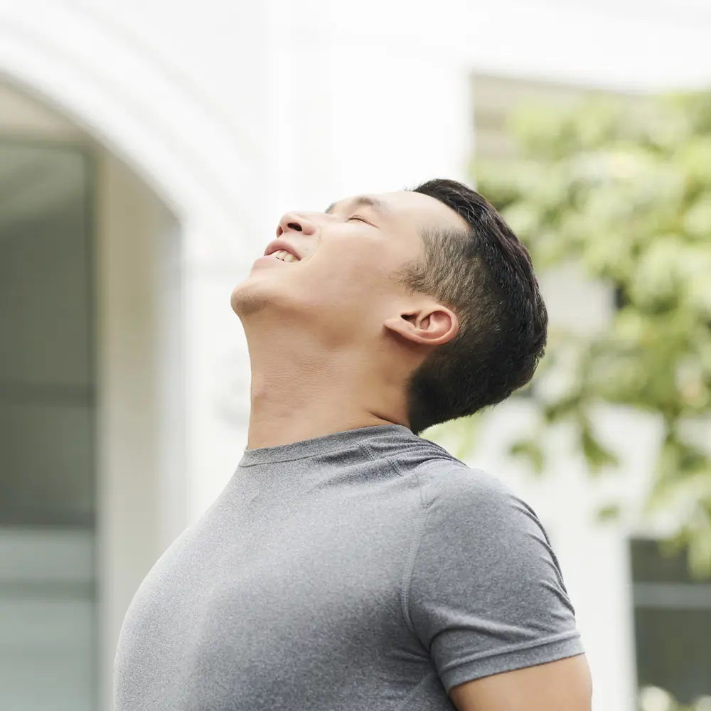 Man after quit smoking hypnosis session, breathing Man after quit smoking hypnosis session in Sydney clinic, breathing in park