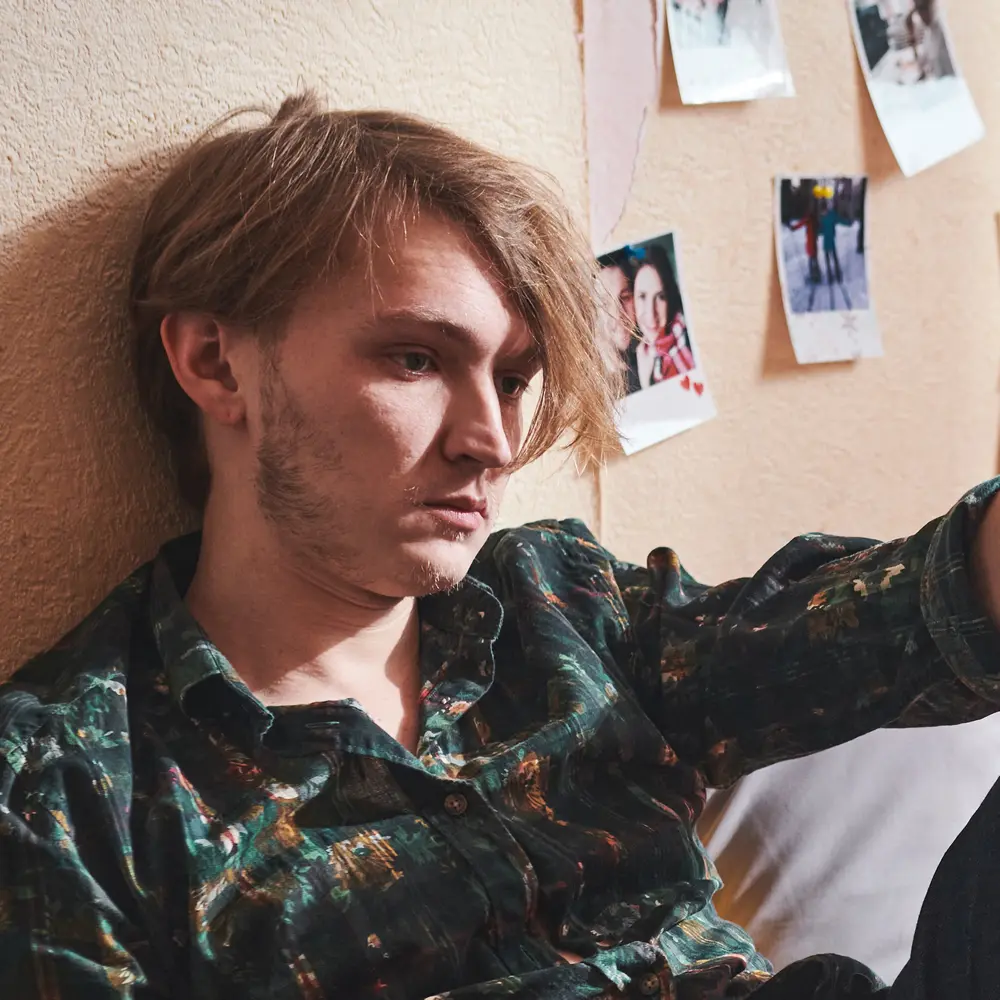 Young man before hypnotherapy for depression Young man before hypnotherapy for depression looking sad